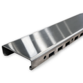 Solid polished chrome trench grate that ships with this closeout pan, angled view