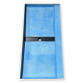Wall to wall closeout shower pan, blue skim coated surface, close view of the prepped tile ready finish